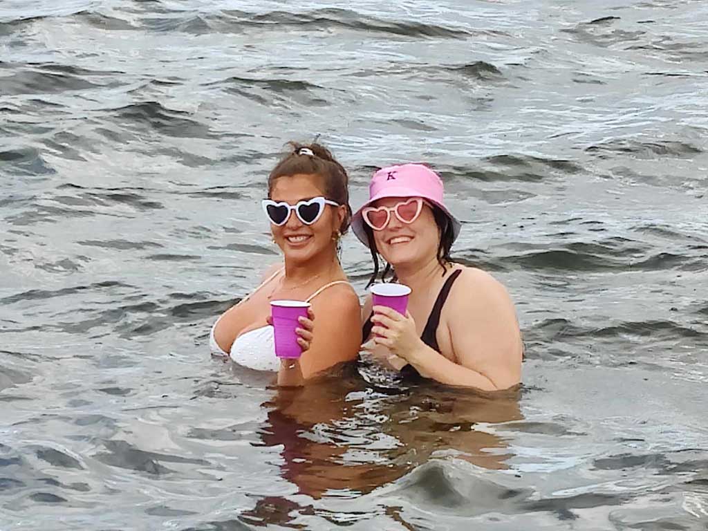 Two girls on a Sandbar Tour swim